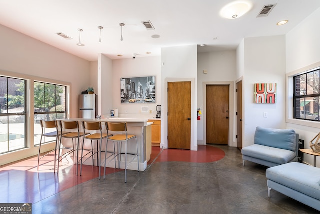 791 Wylie St SE Unit 912, Atlanta, GA 30316 - kitchen with visible vents, freestanding refrigerator, and concrete floors