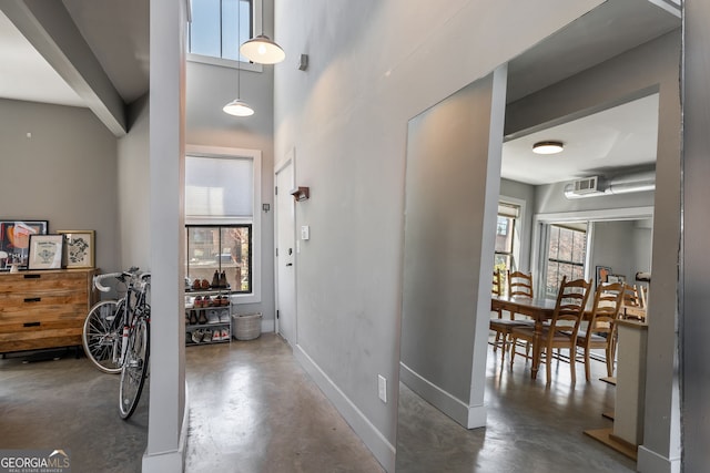 791 Wylie St SE Unit 912, Atlanta, GA 30316 - corridor featuring baseboards, concrete floors, and a high ceiling