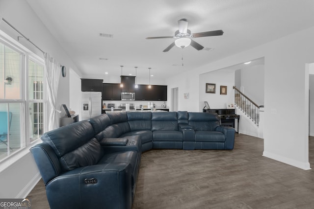 113 Hamlet Ct, Hinesville, GA 31313 - living area with stairway, a ceiling fan, and dark wood-type flooring