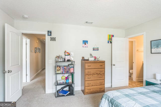 113 Hamlet Ct, Hinesville, GA 31313 - bedroom with baseboards, a textured ceiling, and light carpet