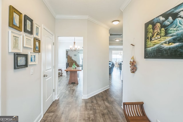 113 Hamlet Ct, Hinesville, GA 31313 - hallway with ornamental molding, dark wood-style floors, a chandelier, and stairs
