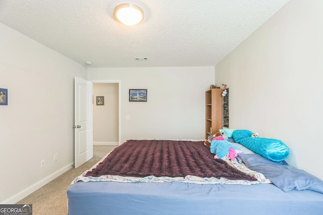 113 Hamlet Ct, Hinesville, GA 31313 - bedroom with visible vents, carpet flooring, a textured ceiling, and baseboards