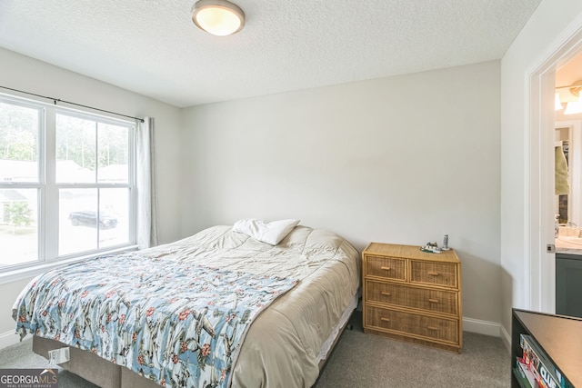 113 Hamlet Ct, Hinesville, GA 31313 - carpeted bedroom with baseboards and a textured ceiling