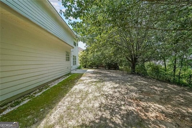 1528 Rogers Crossing Dr, Lithonia, GA 30058 - view of yard featuring a patio