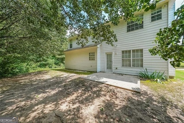 back of property featuring a patio area