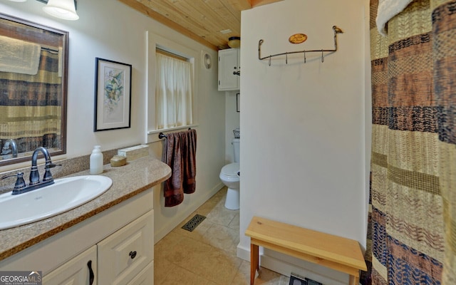 bathroom with vanity, toilet, tile patterned floors, wooden ceiling, and visible vents