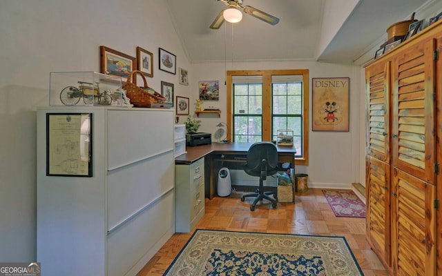 office area featuring crown molding, baseboards, a ceiling fan, and lofted ceiling