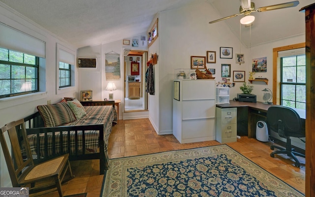 office with a ceiling fan, vaulted ceiling, and a wealth of natural light