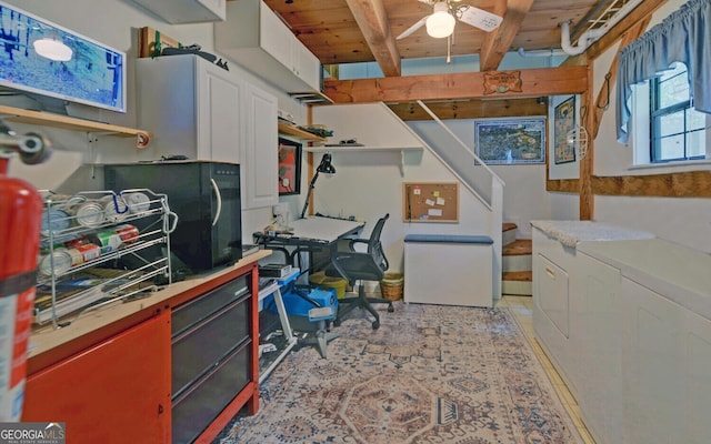 interior space featuring washer and clothes dryer, ceiling fan, wooden ceiling, and beamed ceiling