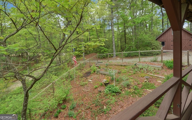 view of yard with an outbuilding and a vegetable garden