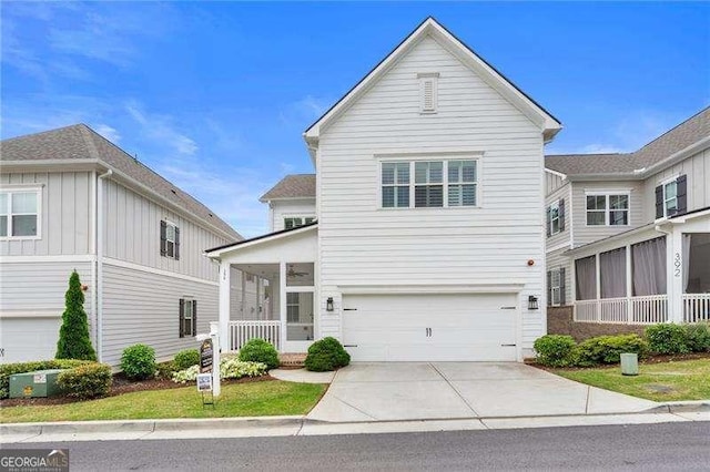 view of front of property featuring concrete driveway and an attached garage