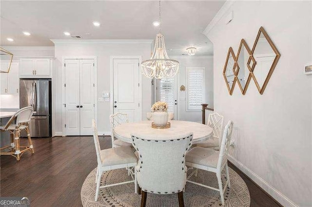 dining area with recessed lighting, a chandelier, ornamental molding, and dark wood-type flooring