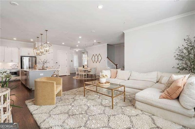 living area with recessed lighting, dark wood-style floors, and ornamental molding