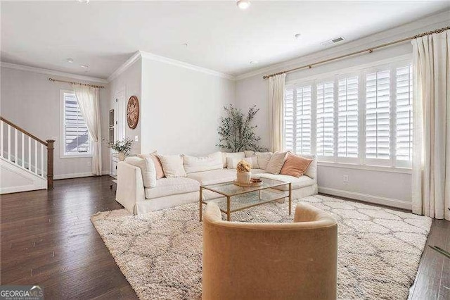 living area featuring crown molding, stairs, baseboards, wood finished floors, and visible vents
