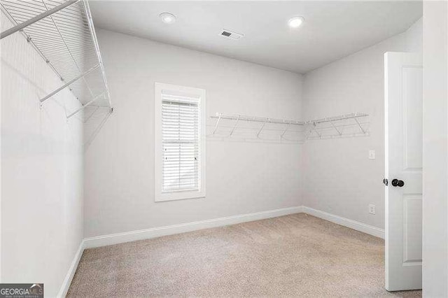 walk in closet with carpet and visible vents