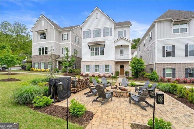 view of patio / terrace with an outdoor fire pit