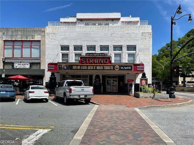 view of property featuring uncovered parking