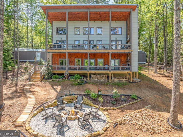 454 N Old Aska Rd, Blue Ridge, GA 30513 - back of house with a fire pit, stairway, a wooden deck, an outdoor structure, and a balcony
