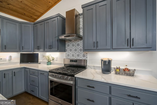 454 N Old Aska Rd, Blue Ridge, GA 30513 - kitchen featuring stainless steel gas range, wall chimney range hood, vaulted ceiling, gray cabinetry, and backsplash