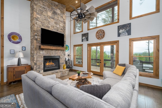 454 N Old Aska Rd, Blue Ridge, GA 30513 - living area with high vaulted ceiling, a ceiling fan, hardwood / wood-style floors, plenty of natural light, and a fireplace