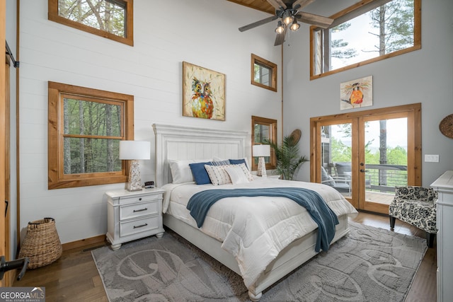 454 N Old Aska Rd, Blue Ridge, GA 30513 - bedroom with wood finished floors, a high ceiling, access to exterior, multiple windows, and wooden walls
