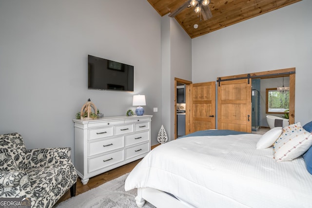 454 N Old Aska Rd, Blue Ridge, GA 30513 - bedroom with high vaulted ceiling, a barn door, dark wood-type flooring, and wood ceiling