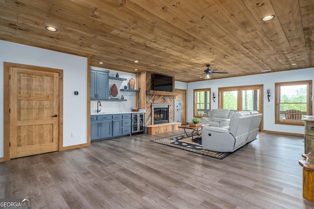 454 N Old Aska Rd, Blue Ridge, GA 30513 - living room featuring ceiling fan, wooden ceiling, wine cooler, baseboards, and wood finished floors