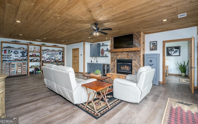 454 N Old Aska Rd, Blue Ridge, GA 30513 - living area featuring wooden ceiling, wood finished floors, a large fireplace, a ceiling fan, and beverage cooler