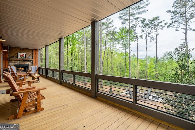 454 N Old Aska Rd, Blue Ridge, GA 30513 - deck featuring a fireplace and a wooded view
