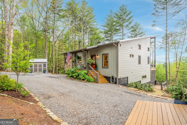 454 N Old Aska Rd, Blue Ridge, GA 30513 - view of front of house with a shed, an outdoor structure, driveway, and a chimney