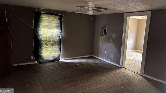 700 W College St, Bowdon, GA 30108 - empty room featuring a ceiling fan, a textured ceiling, baseboards, and hardwood / wood-style floors
