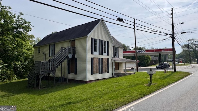 700 W College St, Bowdon, GA 30108 - view of side of home featuring a lawn
