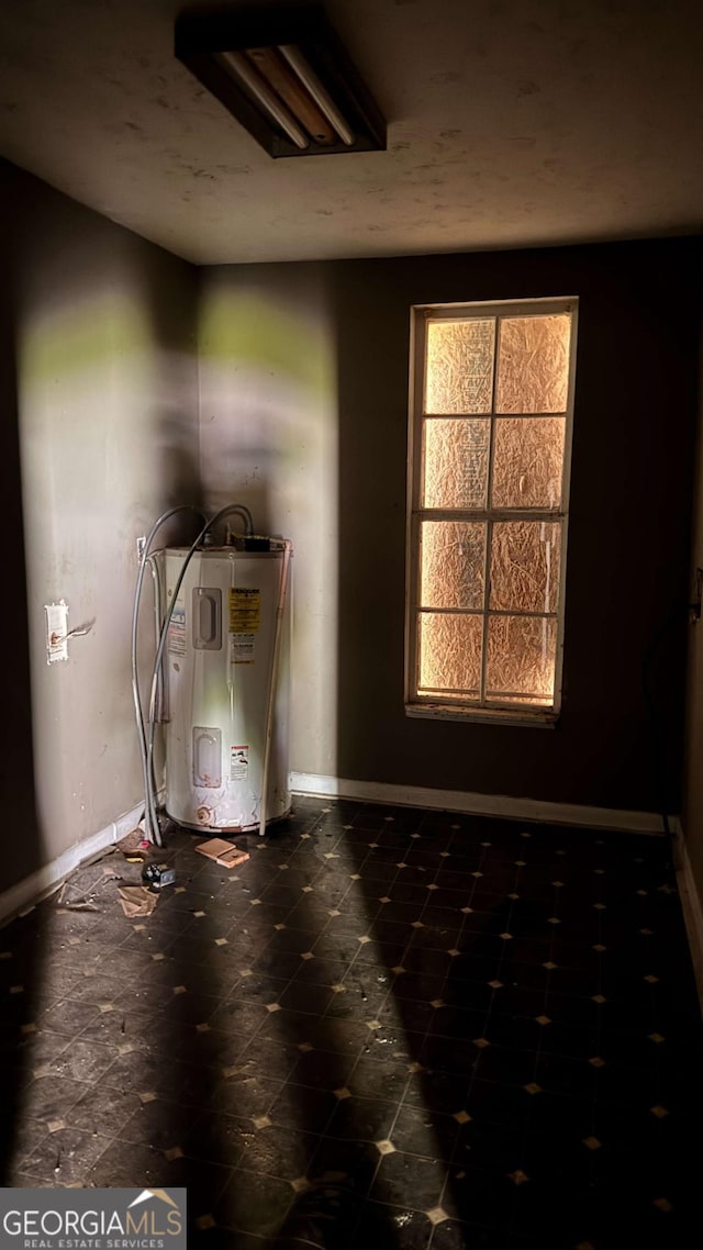 700 W College St, Bowdon, GA 30108 - interior space featuring baseboards and electric water heater
