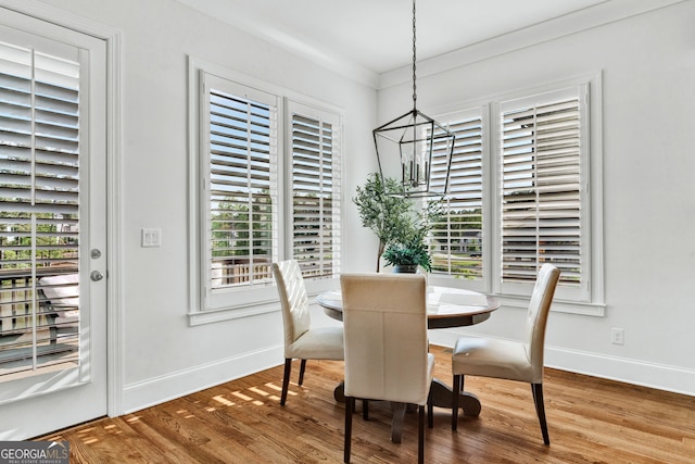 2201 Old Dallas Rd SW, Marietta, GA 30064 - dining room featuring a chandelier, baseboards, and wood finished floors
