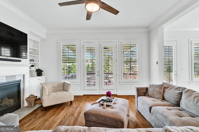 2201 Old Dallas Rd SW, Marietta, GA 30064 - living area featuring ornamental molding, a healthy amount of sunlight, wood finished floors, and ceiling fan