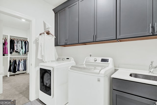2201 Old Dallas Rd SW, Marietta, GA 30064 - laundry room with light carpet, a sink, separate washer and dryer, and cabinet space