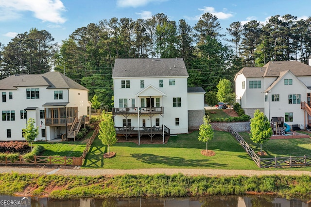 2201 Old Dallas Rd SW, Marietta, GA 30064 - back of property featuring a fenced backyard, a wooden deck, a yard, and stairway