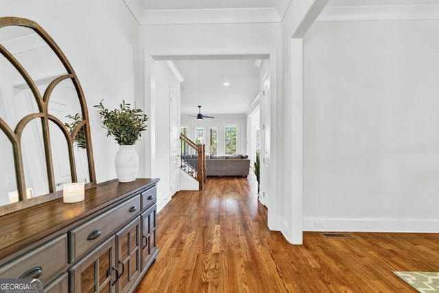 2201 Old Dallas Rd SW, Marietta, GA 30064 - foyer with a ceiling fan, baseboards, ornamental molding, light wood finished floors, and visible vents