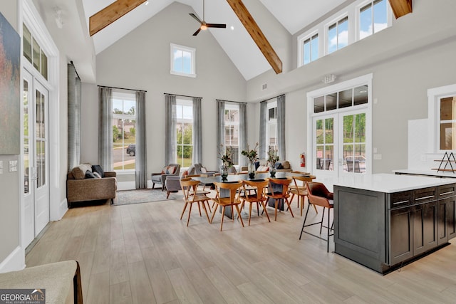 2201 Old Dallas Rd SW, Marietta, GA 30064 - interior space with light wood finished floors, beam ceiling, a ceiling fan, and high vaulted ceiling