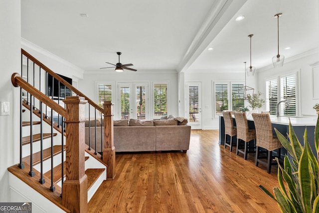 2201 Old Dallas Rd SW, Marietta, GA 30064 - living room featuring wood finished floors, recessed lighting, stairway, crown molding, and a ceiling fan