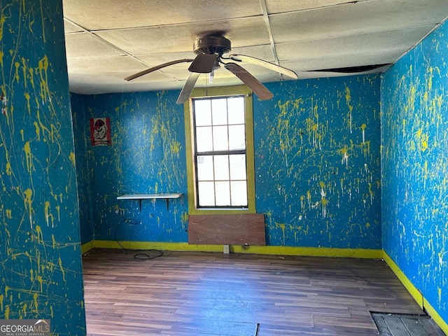 405 Magnolia St, Lafayette, GA 30728 - unfurnished room featuring baseboards, ceiling fan, wallpapered walls, and wood finished floors