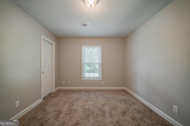 228 Amour Way SW, Lilburn, GA 30047 - carpeted spare room featuring a textured ceiling and baseboards