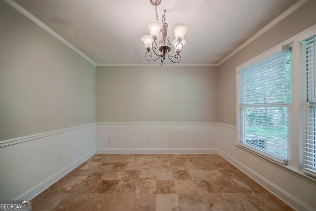 228 Amour Way SW, Lilburn, GA 30047 - unfurnished room featuring baseboards, a notable chandelier, stone finish flooring, and ornamental molding