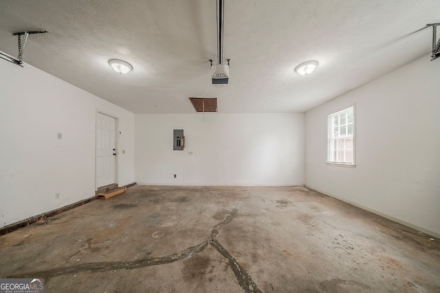 228 Amour Way SW, Lilburn, GA 30047 - garage with electric panel and a garage door opener