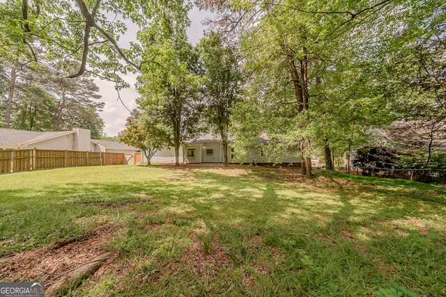 228 Amour Way SW, Lilburn, GA 30047 - view of yard featuring fence