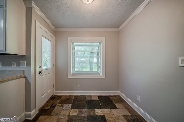 228 Amour Way SW, Lilburn, GA 30047 - doorway to outside featuring dark stone finish flooring, ornamental molding, and a textured ceiling