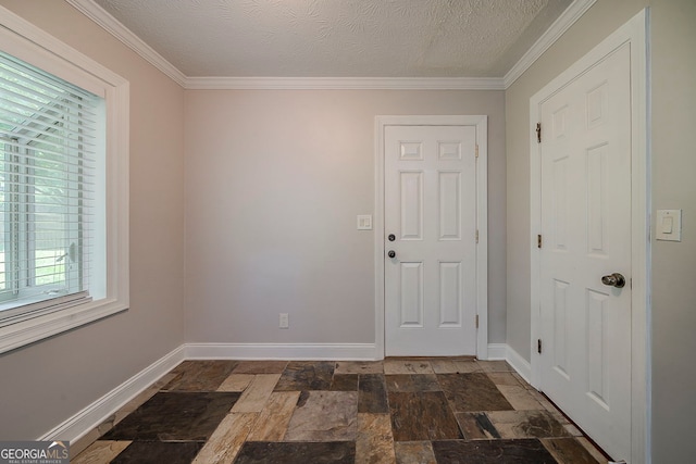 228 Amour Way SW, Lilburn, GA 30047 - entrance foyer featuring stone tile flooring, ornamental molding, and a textured ceiling