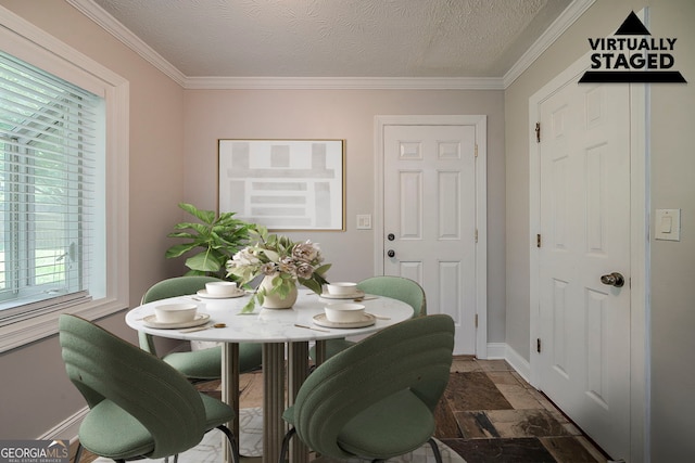 228 Amour Way SW, Lilburn, GA 30047 - dining room featuring baseboards, ornamental molding, a textured ceiling, and stone tile flooring