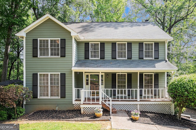 929 Hampton Trl NW, Lilburn, GA 30047 - traditional home featuring a porch and a shingled roof