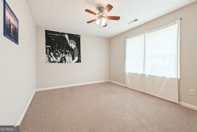 1366 Maple Ridge Dr, Suwanee, GA 30024 - spare room with visible vents, baseboards, plenty of natural light, a ceiling fan, and carpet